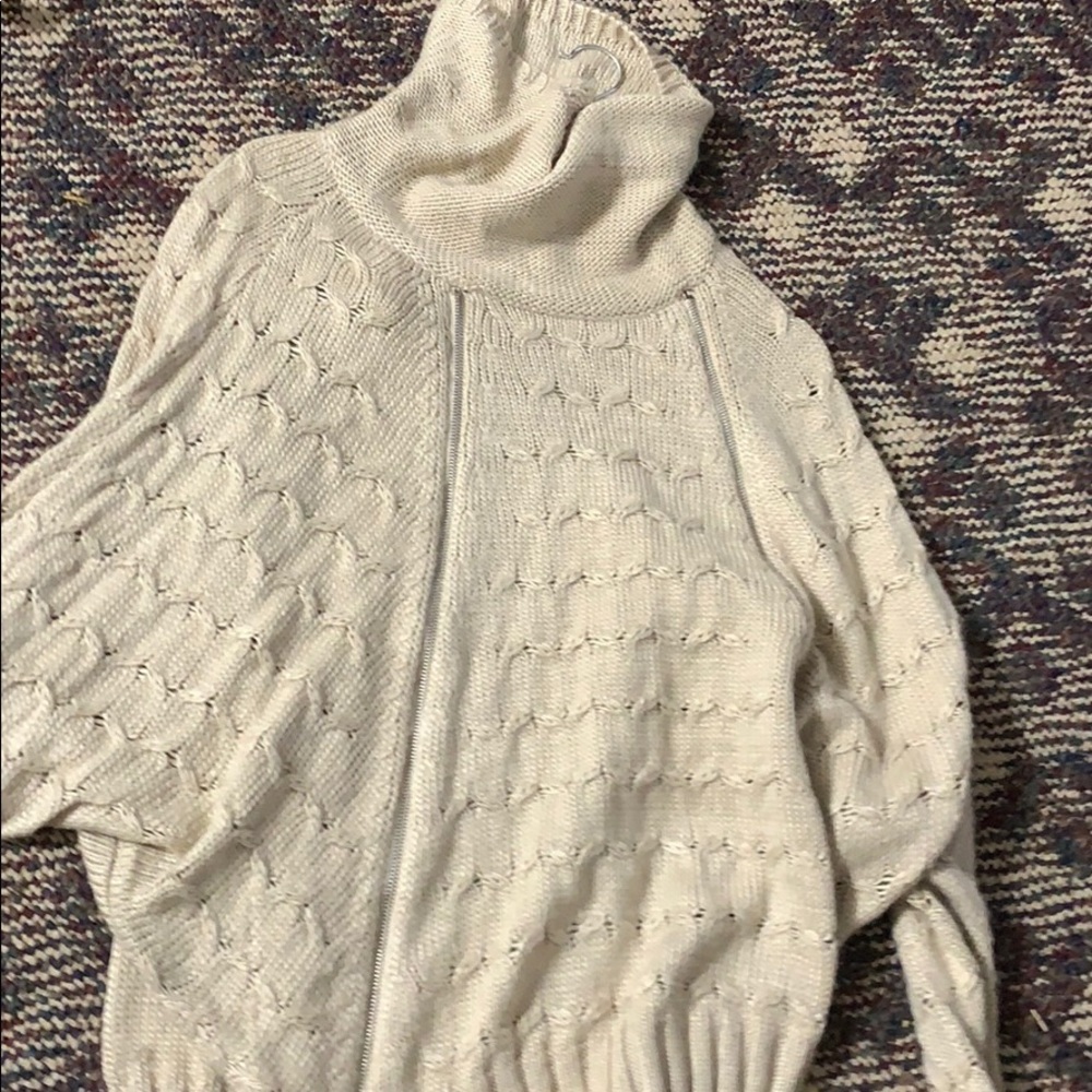 Maurice’s small turtle neck sweater